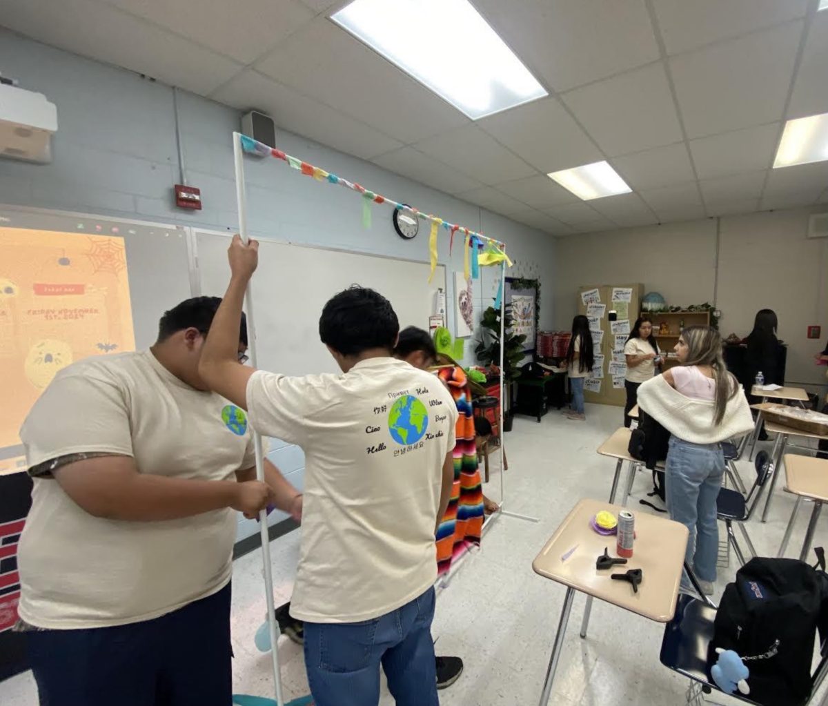 Members of the World Language Club work on dismantling their Hispanic Heritage Month decorations at their Oct. 8 meeting as they make preparations for Dia de Los Muertos.  “I love the inclusivity that World Language Club has, everyone is more than welcome here!” club president Mariana Muñoz said. For more information, please see club sponsor Ms. Barban.